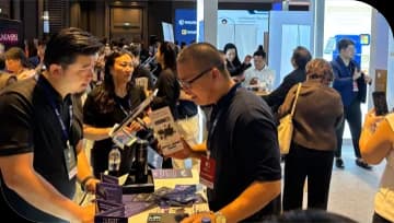 GTC staff engaging with visitors at an event booth